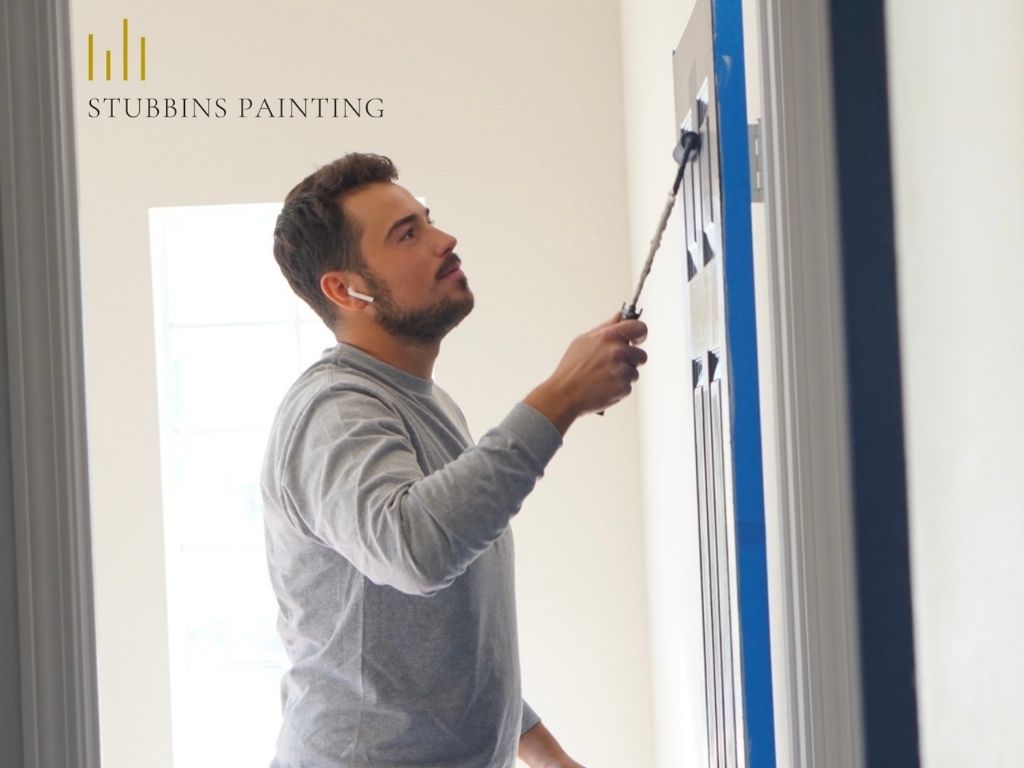 stubbins painting team member painting wall